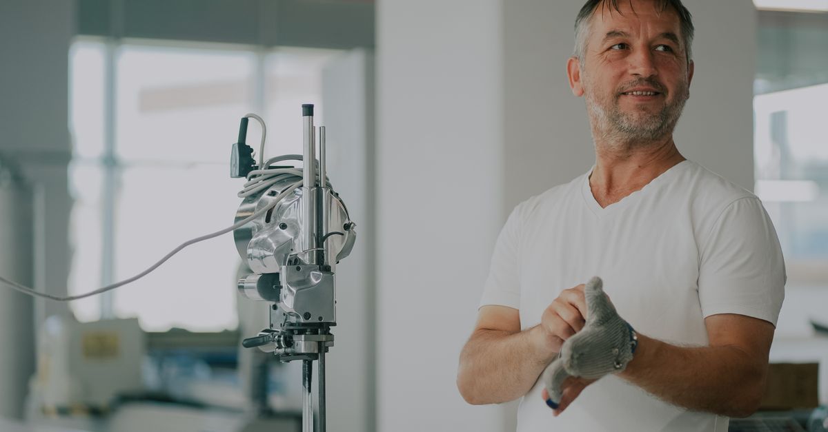 industrial sewing machine factory floor expert inspection mechanic evaluating equipment